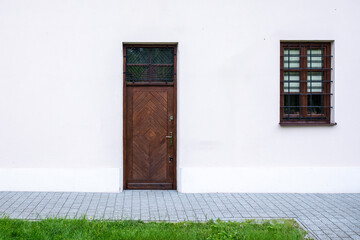 Designer entrance door to a country house. Modern design. Luxurious exterior. Facade of a modern building with modern doors.