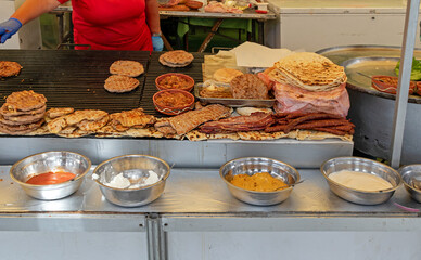 Tasty traditional Balkan meat food sold outside on local market stall on agricultural fair