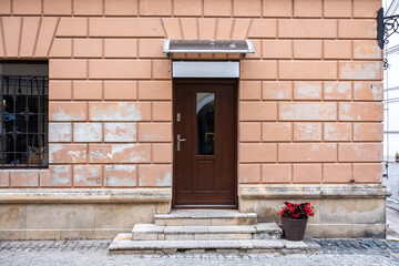 Designer entrance door to a country house. Modern design. Luxurious exterior. Facade of a modern building with modern doors.
