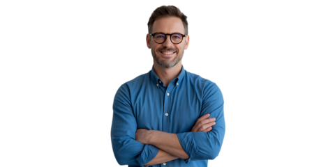 A smiling man with glasses stands with his arms crossed, looking directly at the camera.