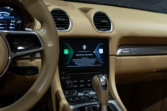 Porsche 718 Boxster S infotainment screen, Tan interior, PDK shifter detail