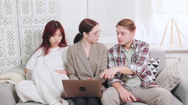 A multiracial couple discusses personal issues with a psychologist in the comfort of their living room during a mental health support session. - Powered by Adobe