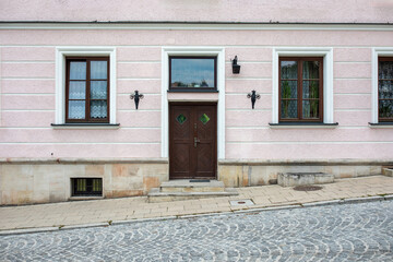 Designer entrance door to a country house. Modern design. Luxurious exterior. Facade of a modern building with modern doors.