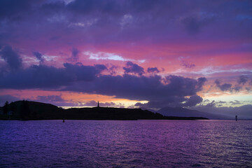 Sunset over Oban Bay and the entrance to Oban harbour with the isle of Kerrera in the back	