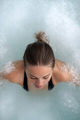 Serene Escape: A woman finds tranquility in a bubbly hot tub, eyes closed in peaceful solitude. Rejuvenation and relaxation come to mind as she takes a break from daily life.