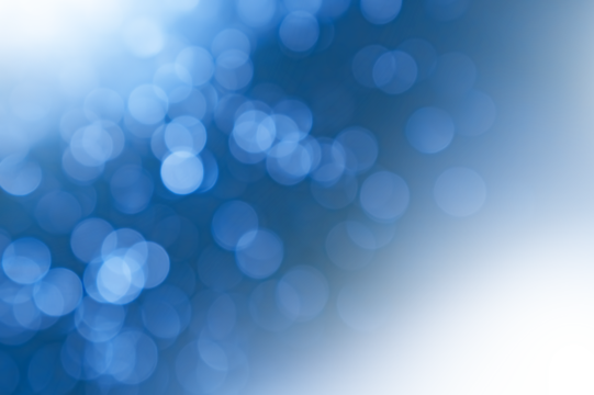 Blue bokeh background with transparent light spots