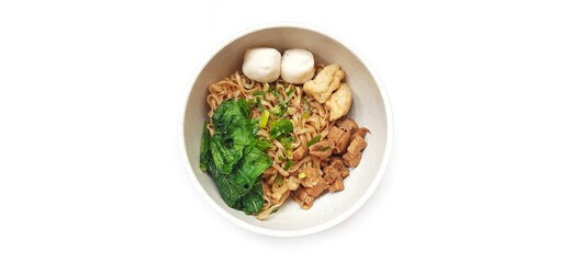 Mie Ayam Indonesian Chicken Noodle Soup with Fish Balls in a Bowl Isolated on White Background. Food Photography