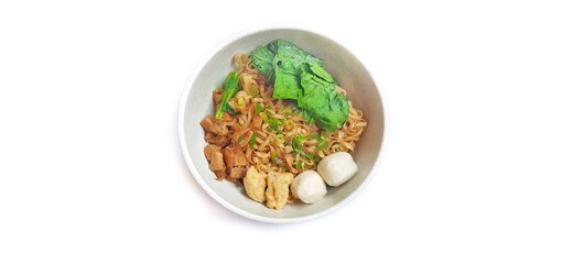 Mie Ayam Indonesian Chicken Noodle Soup with Fish Balls in a Bowl Isolated on White Background. Food Photography