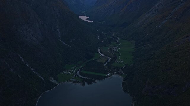 Aerial view of quiet Eikesdalen town glowing in early morning light, Norway