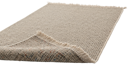 Textured beige woven rug with fringes on black background