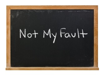 Obraz premium Not my fault handwritten in white chalk on a black chalkboard isolated in a wooden frame