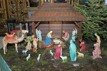 Traditional Christmas nativity scene with Mary and Joseph and baby Jesus in the manger.