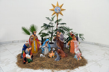 Traditional Christmas nativity scene represented with porcelain figurines of Mary, Joseph and baby Jesus.