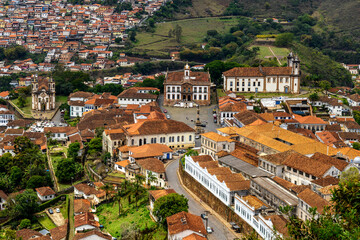 Historic city of Ouro Preto with its baroque and colonial houses and churches, viewed from above.