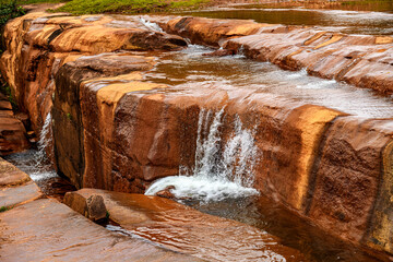 River flowing over rocks and forming small waterfalls in the state of Minas Gerais, Brazil.