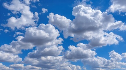 Bright Blue Sky with White Fluffy Clouds Overhead on a Sunny Day Perfect for Nature, Weather, and Outdoor-Themed Projects