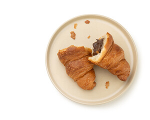 Sliced ​​croissant with chocolate on white isolated background