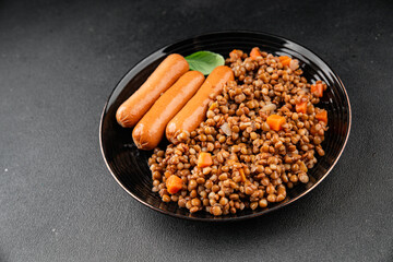 Lentils with sausage second course quick meal natural tasty appetizer fresh delicious gourmet food background on the table rustic top view copy space