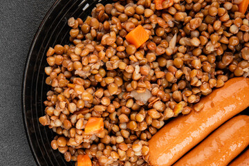 Lentils with sausage second course quick meal natural tasty appetizer fresh delicious gourmet food background on the table rustic top view copy space