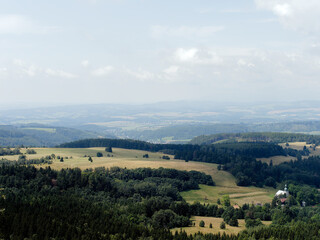 Landscape With Rolling Hills, Meadows, Forest, And A Small Village Church