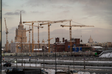 Urban Construction Site with Winter Cityscape Background