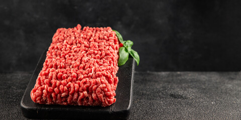 Raw minced meat beef pork ground meat natural product tasty snack fresh delicious gourmet food background on the table rustic top view copy space