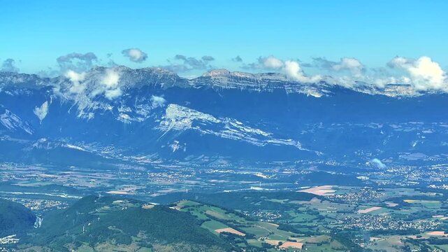 Aerial view of Grenoble city seen from Chamrousse mountain area in the French Alps.