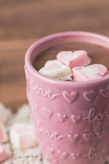 Close Up of Heart-Shaped Pink and White Marshmallows Floating on  a Pink Cup of Hot Chocolate with Love and Hearts