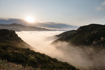 Hilltop view of flowing morning fog in the Porter Ranch and Chatsworth area of Los Angeles California.  