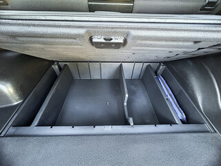 Organizing storage space in a vehicle trunk for optimal convenience and accessibility during road trips