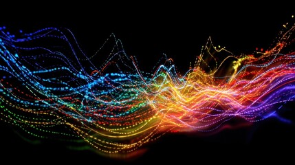 Bright colors swirl and weave together in a vibrant display illuminating the darkness with energy.