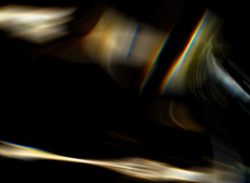 Blurred light overlay background for design. Abstract rays, glares, and glow effects to be used with overlay or screen blending mode. Soft blur caustic light dispersion reflections and smooth blur