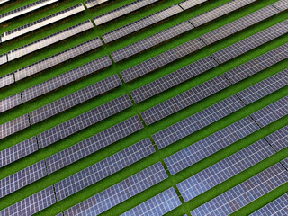 Aerial view of a solar farm producing clean renewable sun energy, industrial landscape