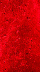 wall painted with red paint with an interesting texture