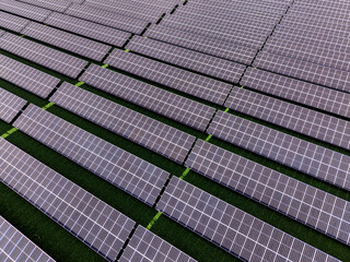 Aerial view of a solar farm producing clean renewable sun energy, industrial landscape