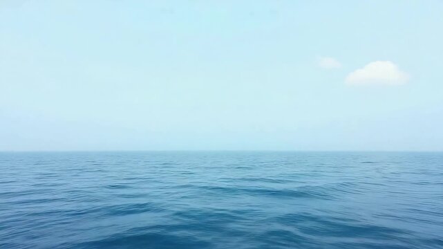 An expansive seascape of boundless horizon, calm waters meeting the vast, serene sky. Capturing a sense of tranquility and limitless exploration. 