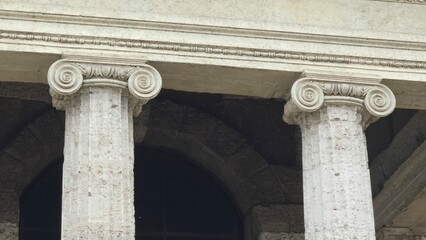 Rome, Italy – 11 January 2025. Detailed shot of the Temple of Portunus reveals carved volutes and...