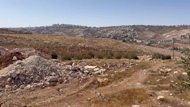 View of the Judean Desert in the Gush Etzion area &mdash; hills, rocks, and sand.