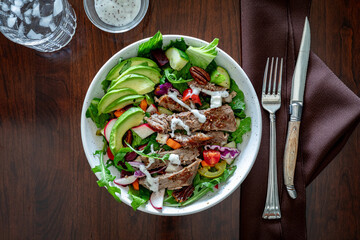 Top down view of a homemade steak salad, ready for eating.