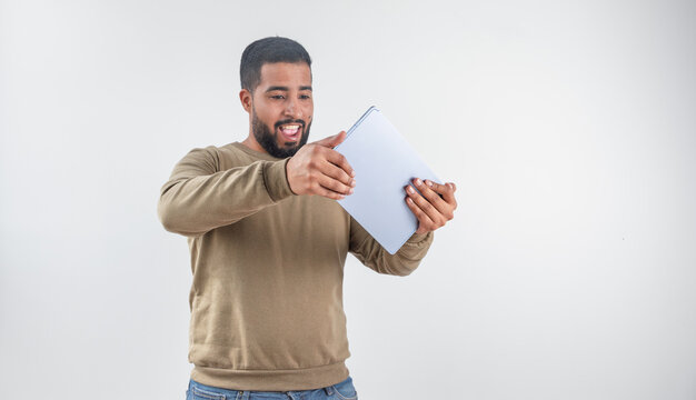 Excited Man Enjoying Content on Tablet