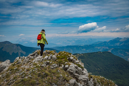 young woman hiking in the mountains