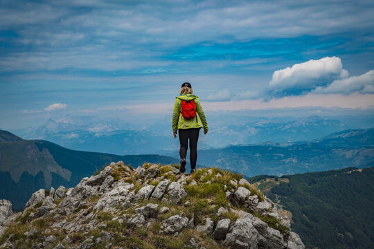 young woman hiking in the mountains