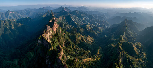 Serene mountain landscape at sunrise with misty blue and pink tones