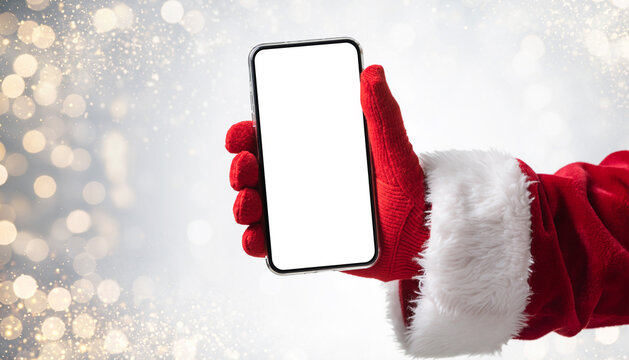 Santa Claus Hand Holding Phone Isolated Blank White Screen. Golden Bokeh Light Background. Close Up. Christmas Gifts Buying. Gloved Hand with Smartphone Vertical MockUp. Advertisement gesture. Banking
