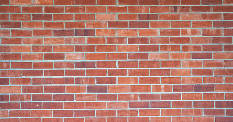 Fototapeta premium Brick wall background. Brickwall for texture or backdrop. Old brick wall of an building. Masonry of stone blocks as background. Brick wall surface. Brick wall wallpaper, High Resolution wallpaper.