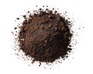Close-up of dark brown soil clump, scattered light particles