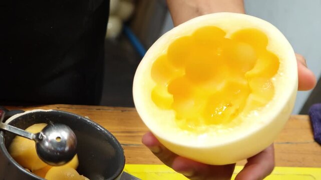 Yellow watermelon, scooped into round pieces