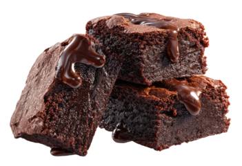 Three rich, decadent brownies stacked, drizzled with melted chocolate