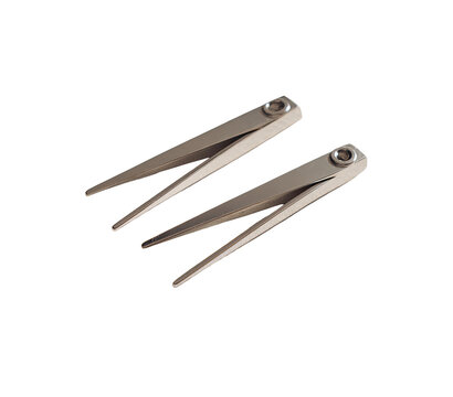 Two angled metal tools, light gray/silver color,  overlapping,  sharp points