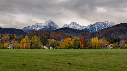 Scenic view of of Alpine valley with Hohenschwangau castle on mountain background at autumn morning, Schwangau, Germany